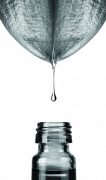 Herbal, alternative medicine, water drop on a leaf isolated on w
